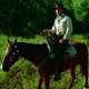 Parker on his horse Lianne singing the movie’s opening number “Shpadoinkle.”